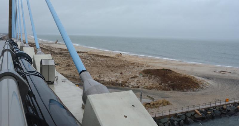 The view from the sidewalk on the bridge crossing the Indian River Inlet shows the beach on the north side of the inlet has received a significant influx of sand this winter from the Massey’s Ditch dredging project and the bypass system that moves sand from the beach south of the inlet. CHRIS FLOOD PHOTOS